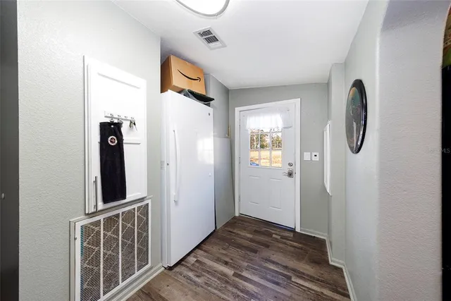a living room with flat screen tv and a fireplace