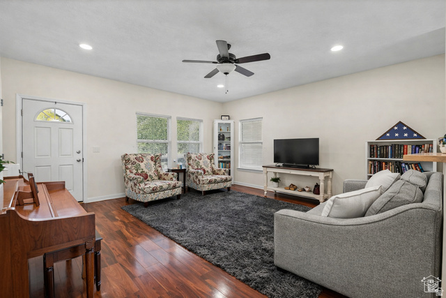 7092 Cherokee Street Eagle Mountain, UT 84005 - Photo 3 of 27 Spacious living area featuring wood-finish flooring, recessed lighting, and a ceiling fan