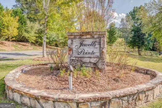 a view of a water fountain in the middle of a yard