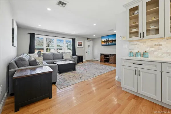 a bedroom with a bed and cabinet