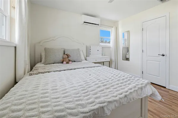 a bedroom with a bed and a dresser