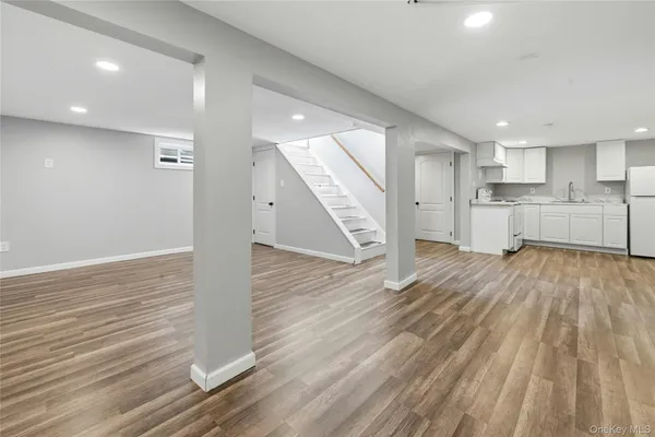 a table and chairs in patio with a small yard