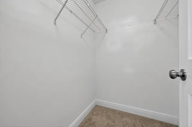 a view of a room with racks on the wall