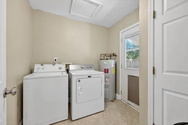 a utility room with dryer and washer