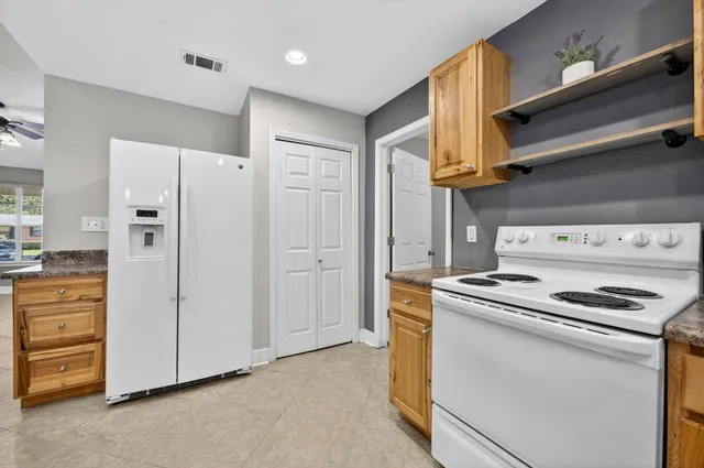 a kitchen with cabinets and appliances