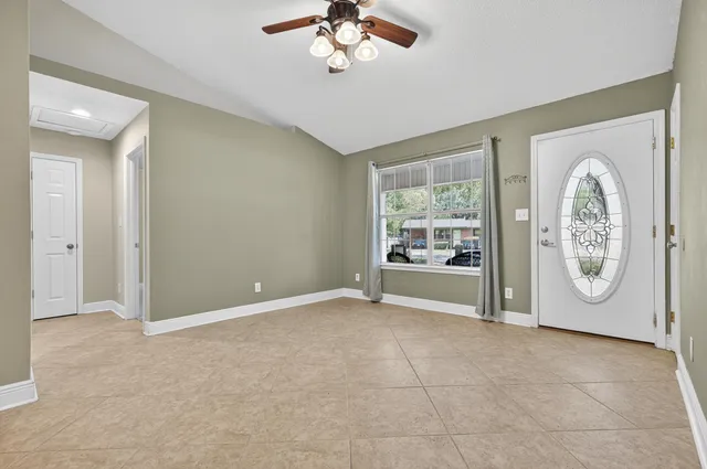 a view of an empty room with a window