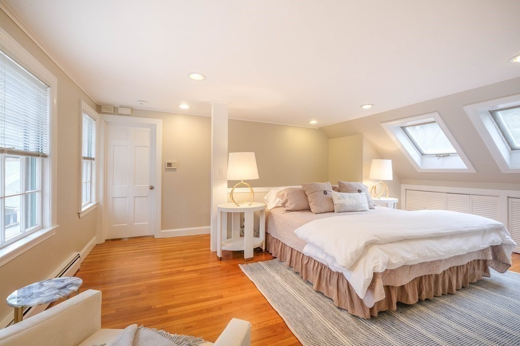 52 Draper Road Wayland, MA 01778 - Photo 22 of 34 a spacious bedroom with a bed and a large window