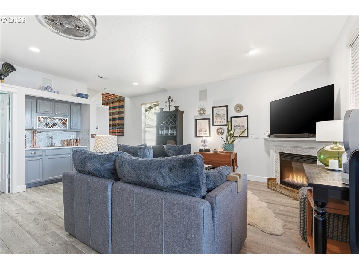 21601 Northeast Willow Glen Road Fairview, OR 97024 - Photo 12 of 48 a living room with furniture and a flat screen tv