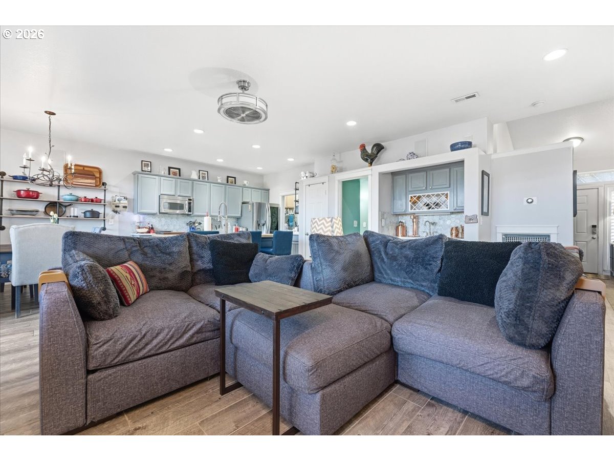 21601 Northeast Willow Glen Road Fairview, OR 97024 - Photo 13 of 48 a living room with furniture and kitchen view