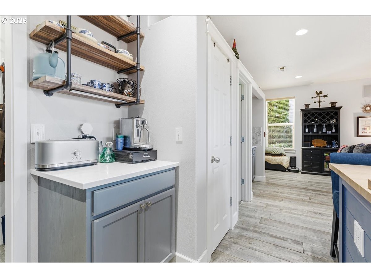 21601 Northeast Willow Glen Road Fairview, OR 97024 - Photo 16 of 48 a kitchen view of a refrigerator stove and wooden floor