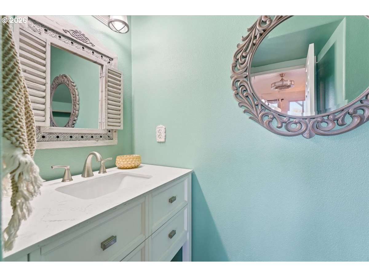 21601 Northeast Willow Glen Road Fairview, OR 97024 - Photo 17 of 48 a bathroom with a sink and mirror