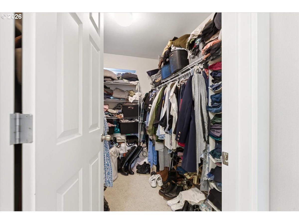 21601 Northeast Willow Glen Road Fairview, OR 97024 - Photo 28 of 48 a view of walk in closet with clothes