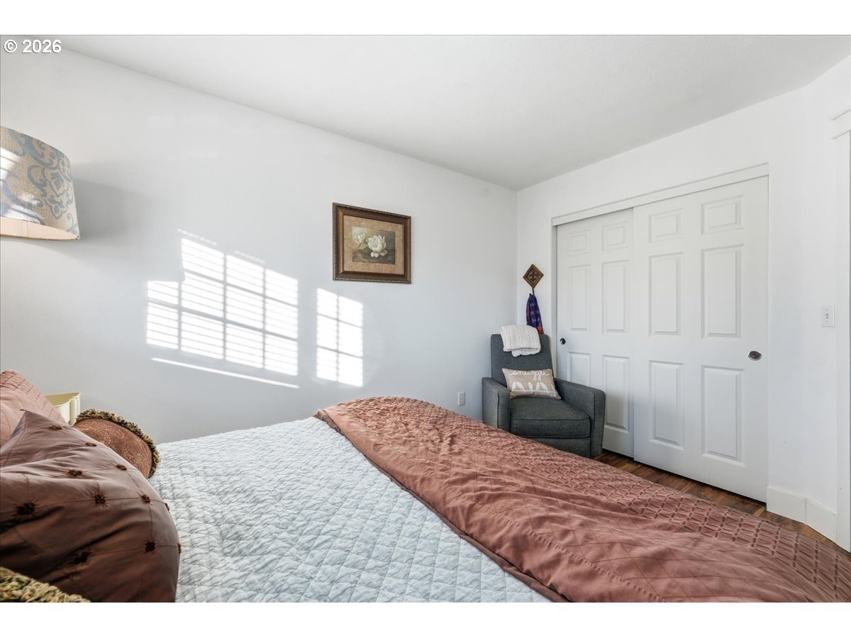 21601 Northeast Willow Glen Road Fairview, OR 97024 - Photo 30 of 48 a bedroom with a bed and a window