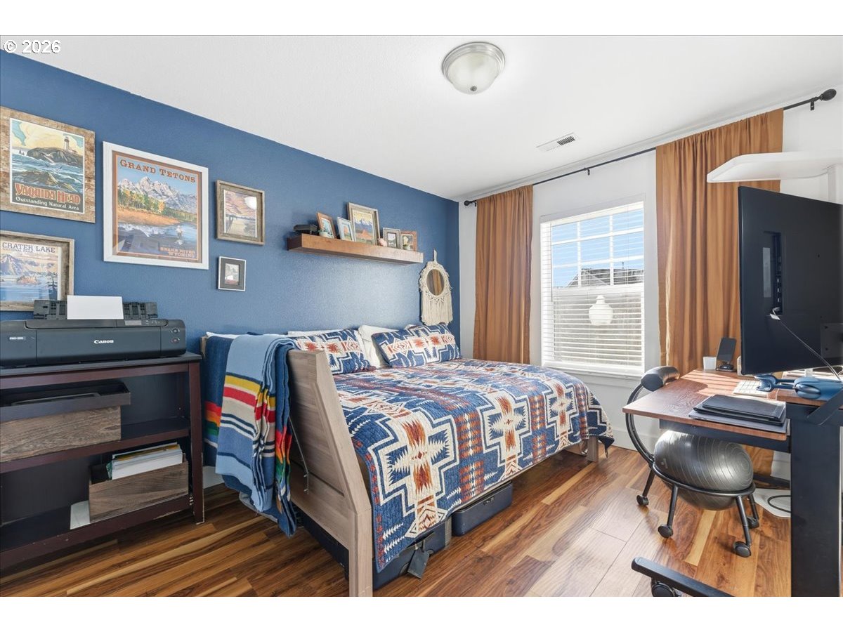 21601 Northeast Willow Glen Road Fairview, OR 97024 - Photo 32 of 48 a bedroom with a bed and a desk