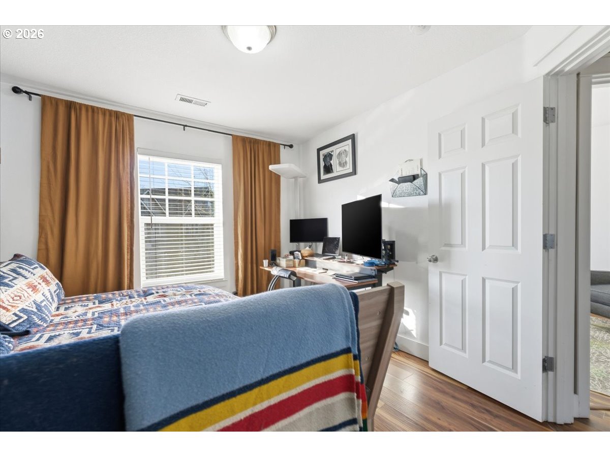 21601 Northeast Willow Glen Road Fairview, OR 97024 - Photo 33 of 48 a living room with furniture a flat screen tv and a window