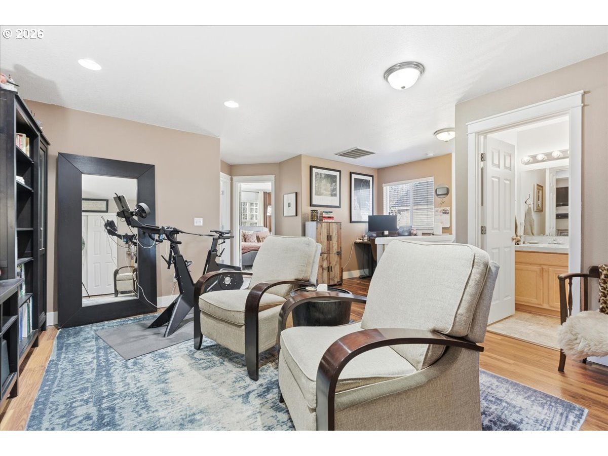 21601 Northeast Willow Glen Road Fairview, OR 97024 - Photo 38 of 48 a living room with furniture a dining table and chairs