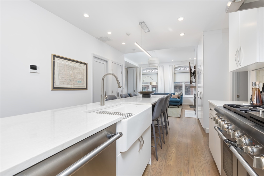 76 West Rutland Square, Unit 104 Boston, MA 02118 - Photo 13 of 23 a kitchen with stainless steel appliances stove a sink and a refrigerator