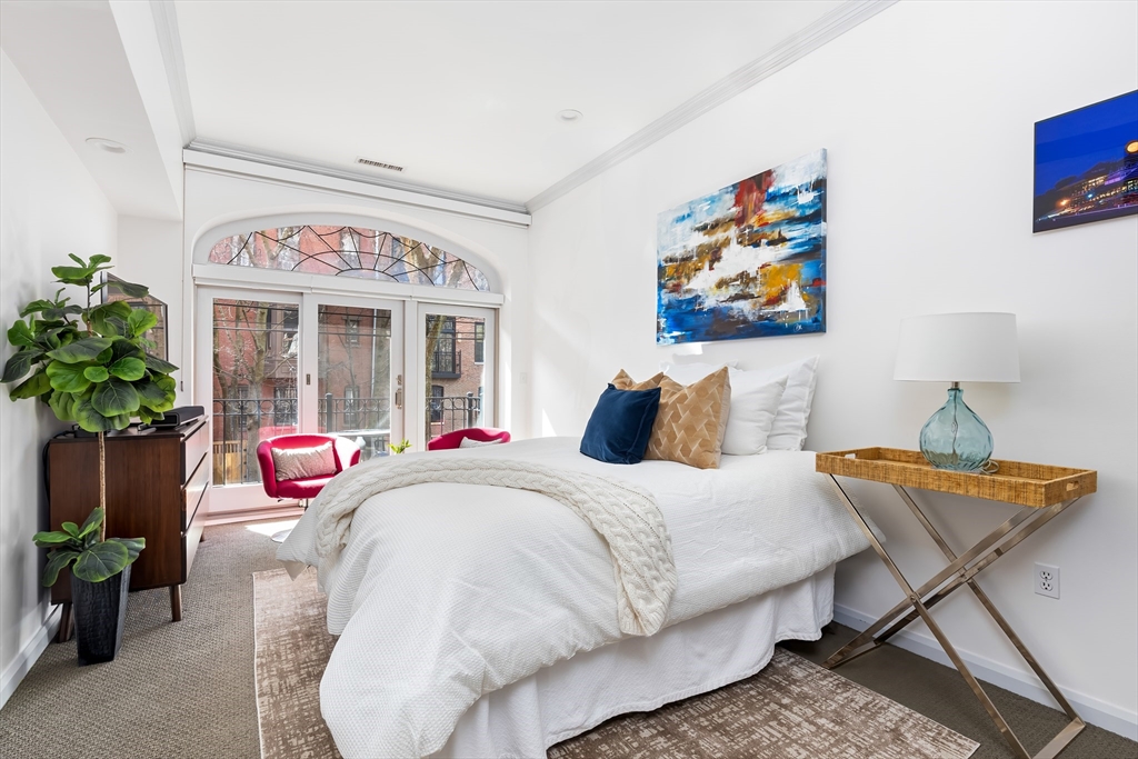 76 West Rutland Square, Unit 104 Boston, MA 02118 - Photo 14 of 23 a bedroom with furniture and a potted plant