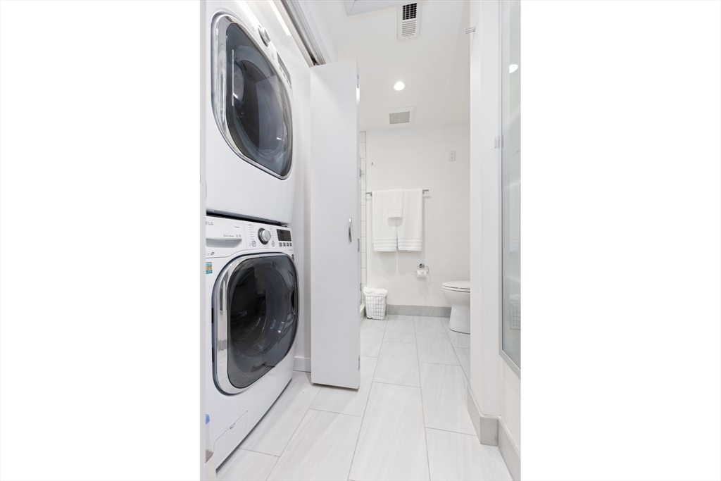 76 West Rutland Square, Unit 104 Boston, MA 02118 - Photo 17 of 23 a utility room with dryer and washer