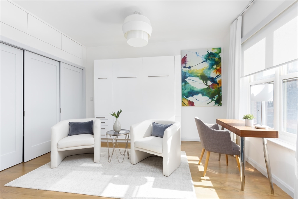 76 West Rutland Square, Unit 104 Boston, MA 02118 - Photo 3 of 23 a living room with furniture and a potted plant