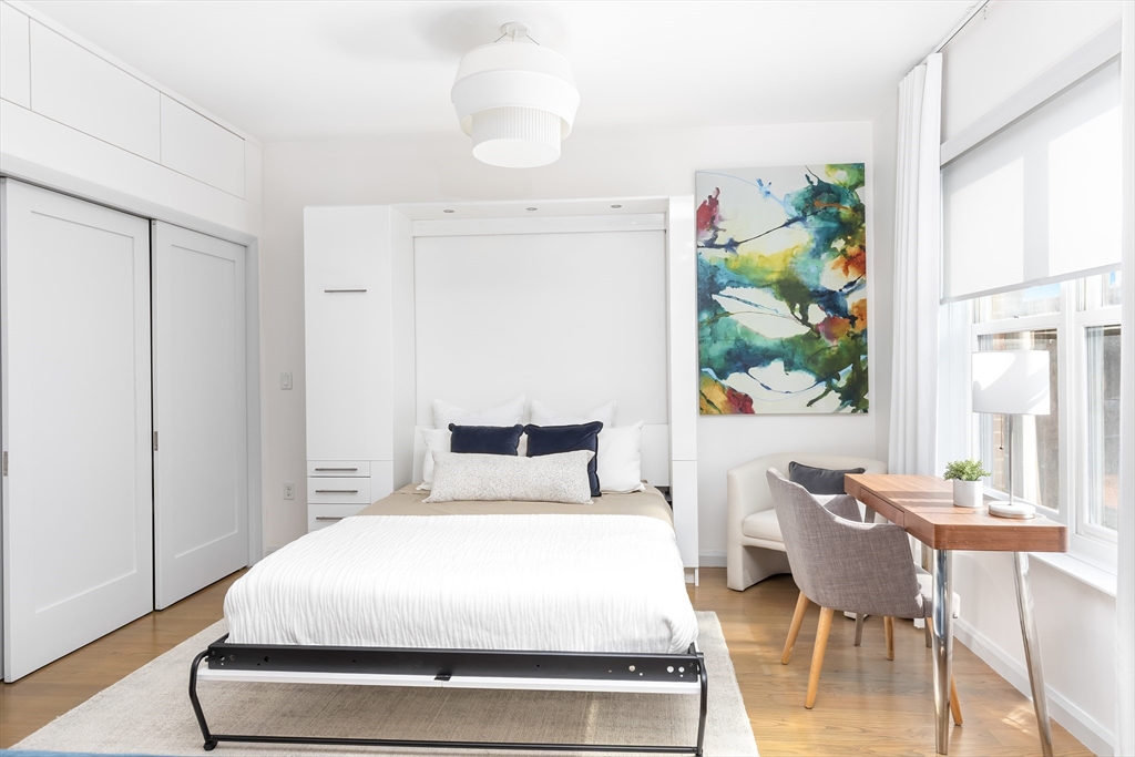 76 West Rutland Square, Unit 104 Boston, MA 02118 - Photo 8 of 23 a bedroom with a bed and a window