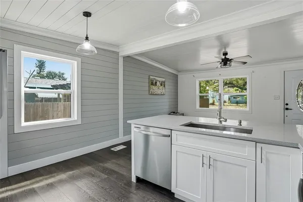 a bathroom with a sink and a window