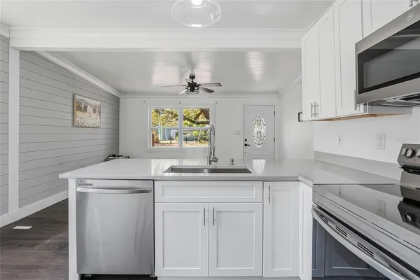 a kitchen with a sink and cabinets