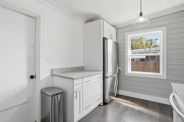 a kitchen with a stove and a refrigerator