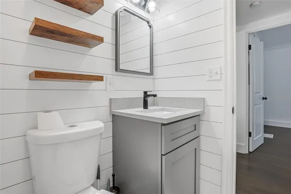 a bathroom with a sink and mirror