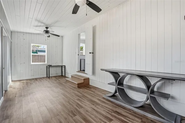 wooden floor in an empty room with a window