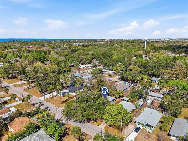 an aerial view of multiple house with yard