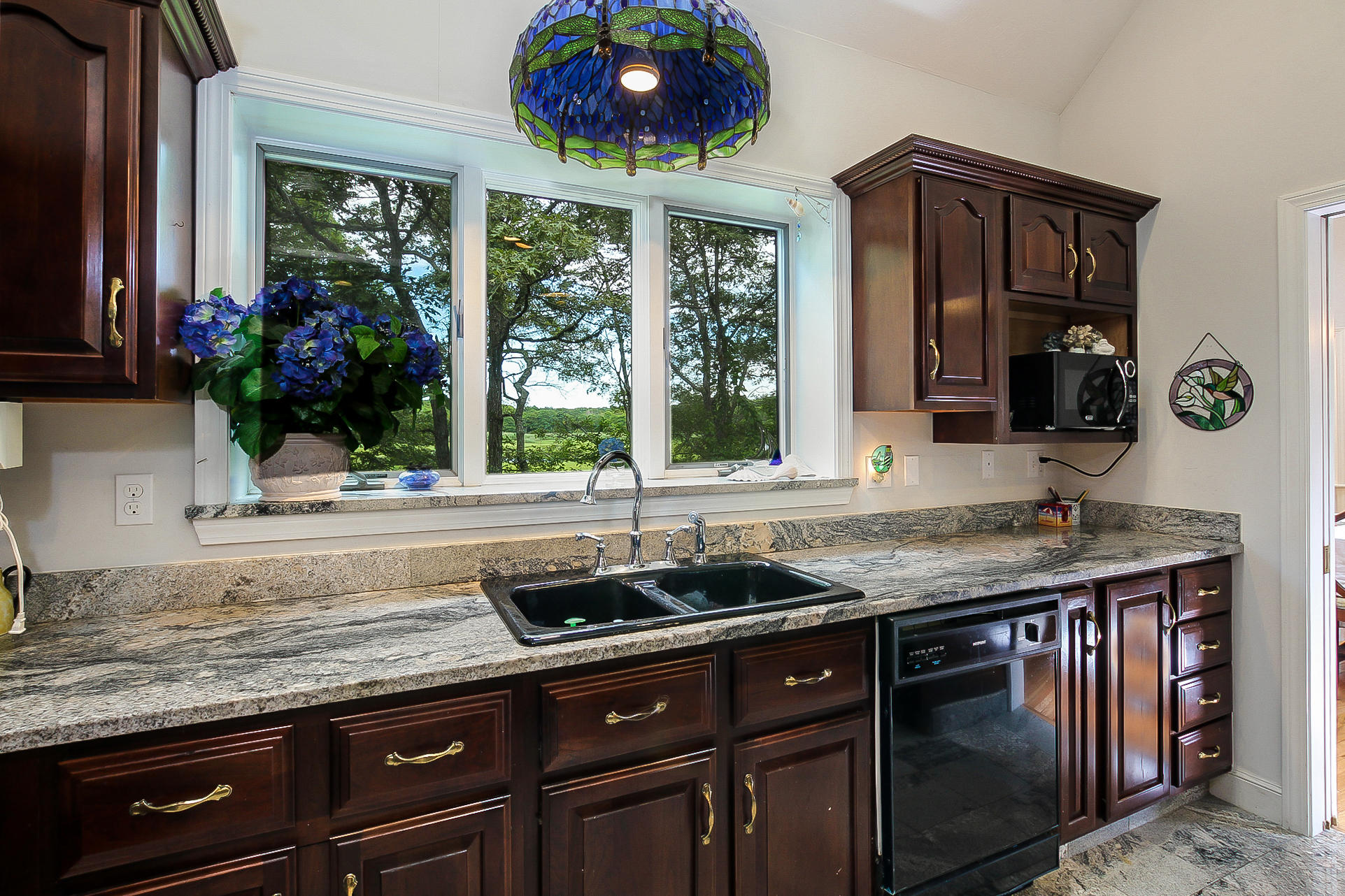 494 Elliott Road Centerville, MA 02632 - Photo 11 of 31 a kitchen with a sink and cabinets
