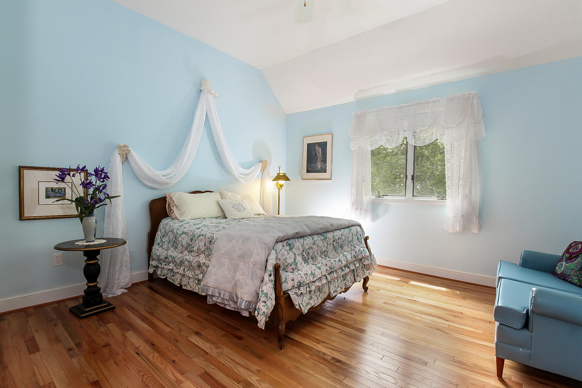 494 Elliott Road Centerville, MA 02632 - Photo 16 of 31 a bedroom with a bed and wooden floor