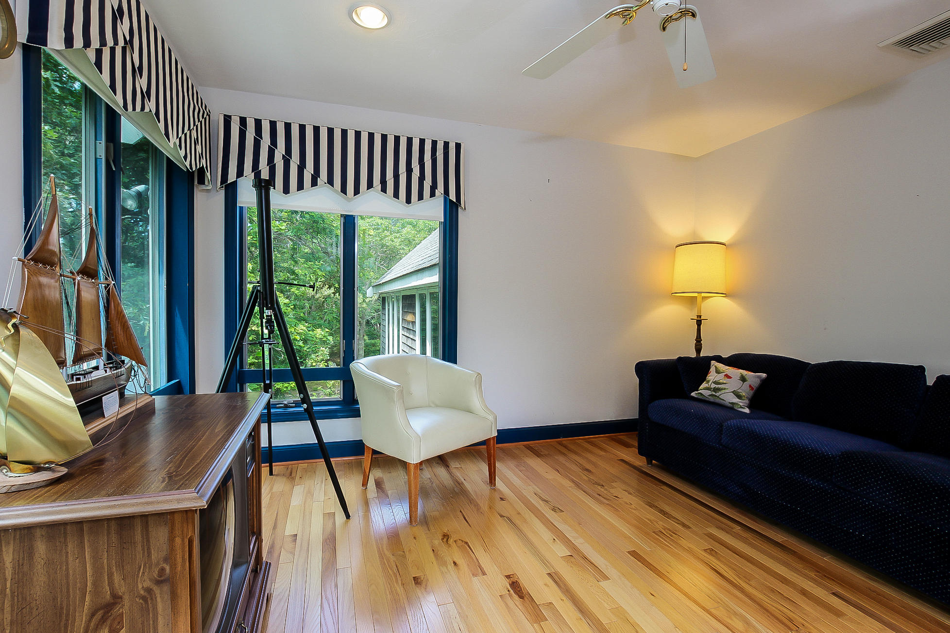 494 Elliott Road Centerville, MA 02632 - Photo 20 of 31 a living room with furniture and a lamp