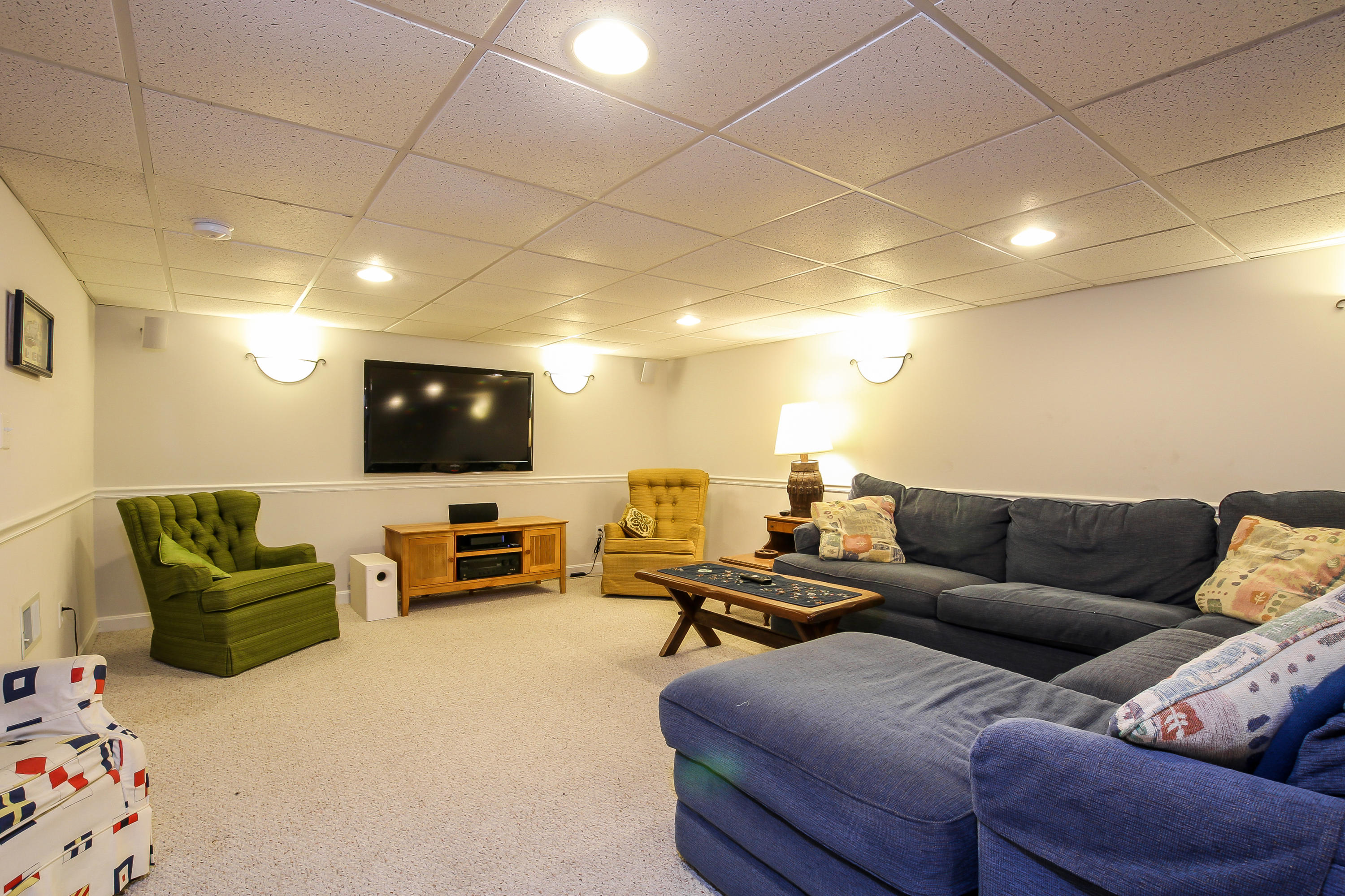 494 Elliott Road Centerville, MA 02632 - Photo 21 of 31 a living room with furniture and a flat screen tv