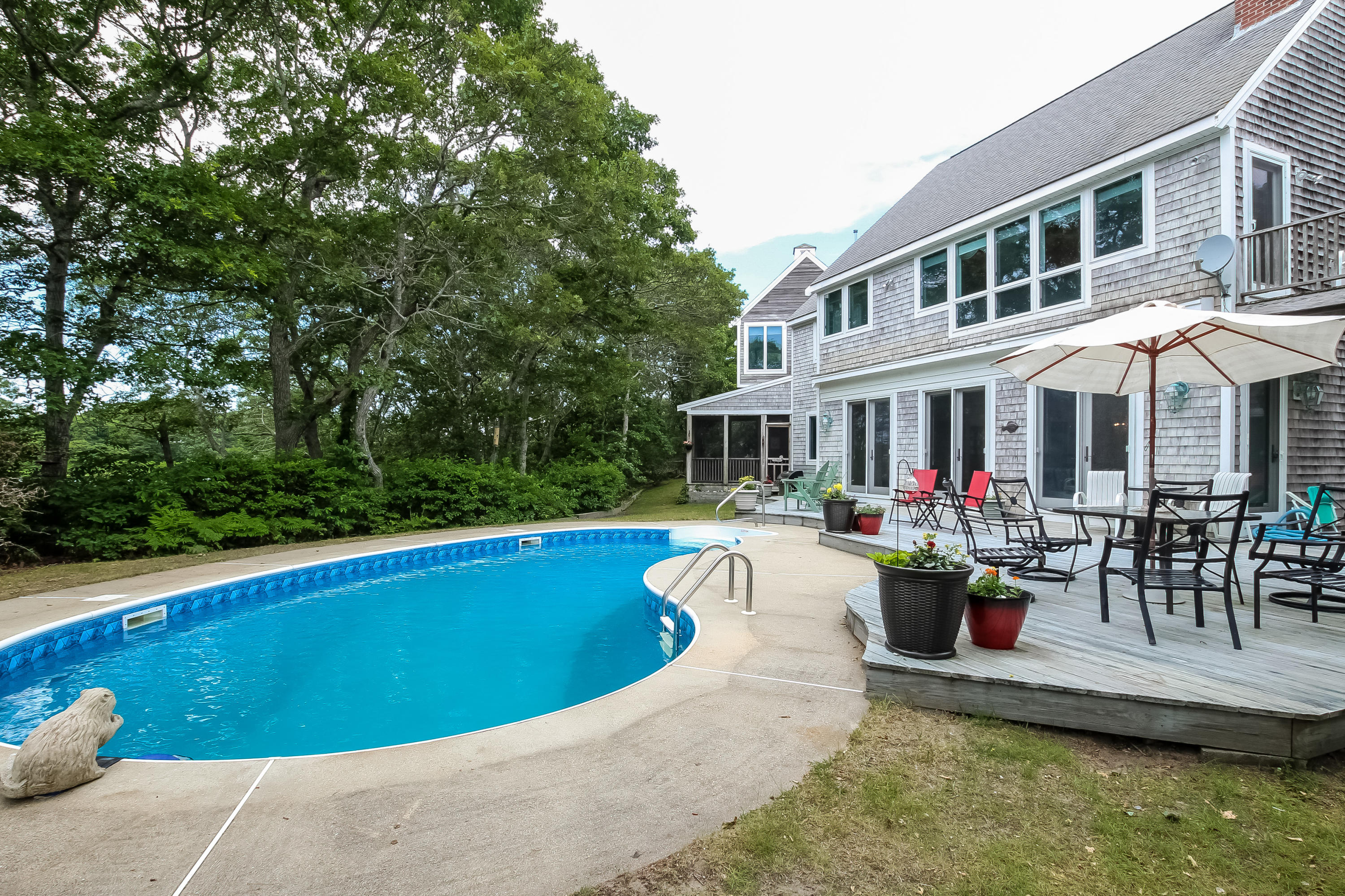 494 Elliott Road Centerville, MA 02632 - Photo 26 of 31 a view of a house with swimming pool and sitting area
