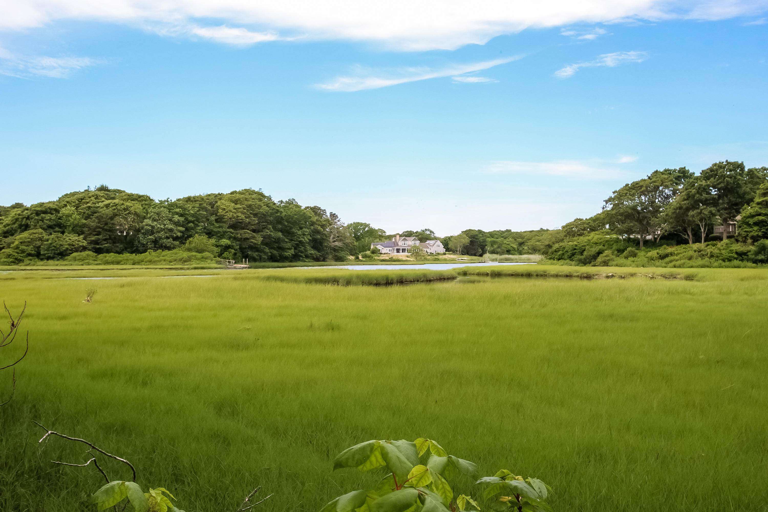 494 Elliott Road Centerville, MA 02632 - Photo 29 of 31 a view of a lake with houses in the background