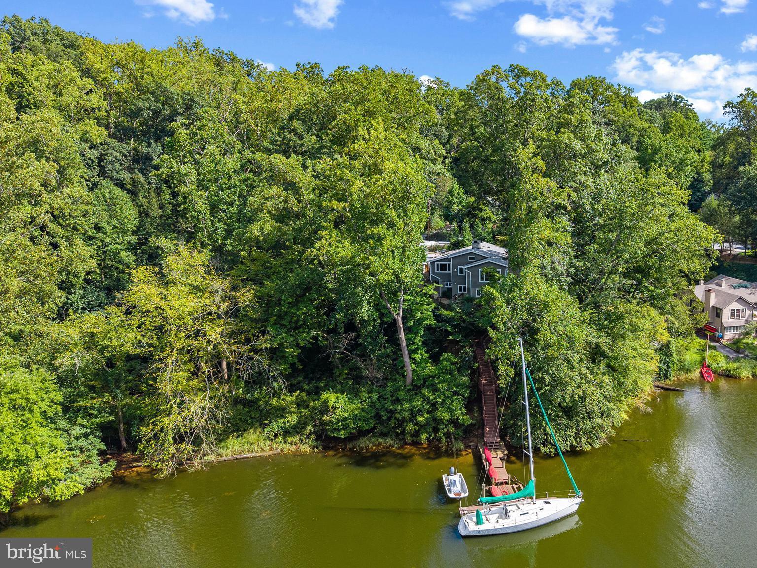 1428 Ravine Way Arnold, MD 21012 - Photo 1 of 43 a view of a lake with a mountain