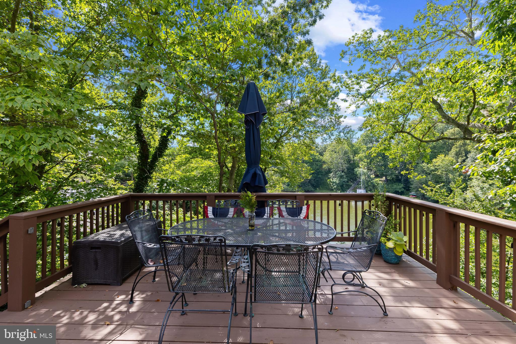 1428 Ravine Way Arnold, MD 21012 - Photo 11 of 43 a view of a patio with a table and chairs
