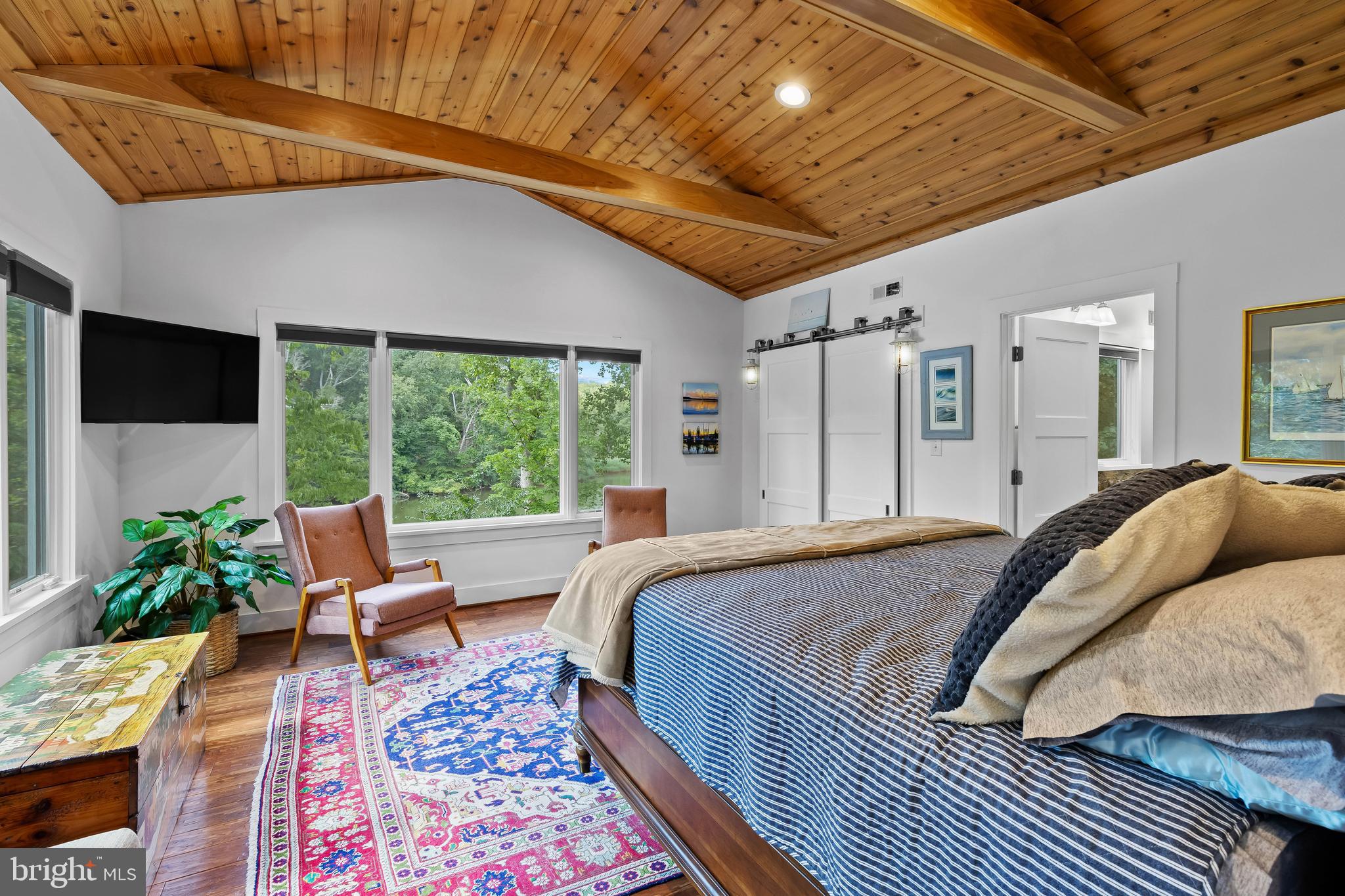 1428 Ravine Way Arnold, MD 21012 - Photo 13 of 43 a bed sitting in a spacious bedroom next to a window