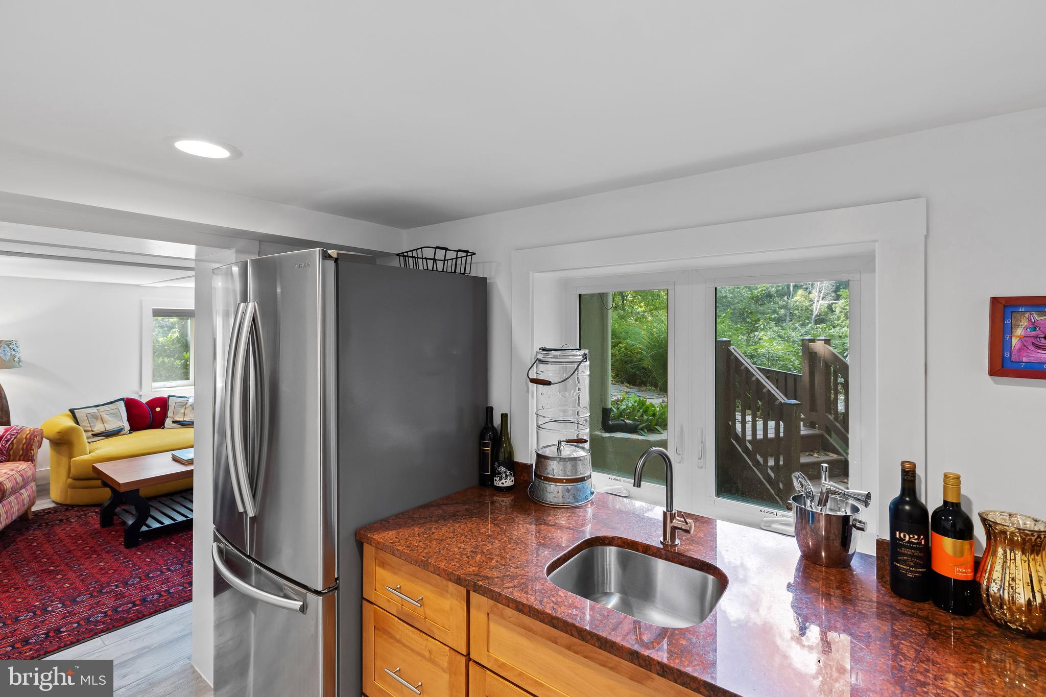 1428 Ravine Way Arnold, MD 21012 - Photo 22 of 43 a kitchen with stainless steel appliances granite countertop a refrigerator and a sink