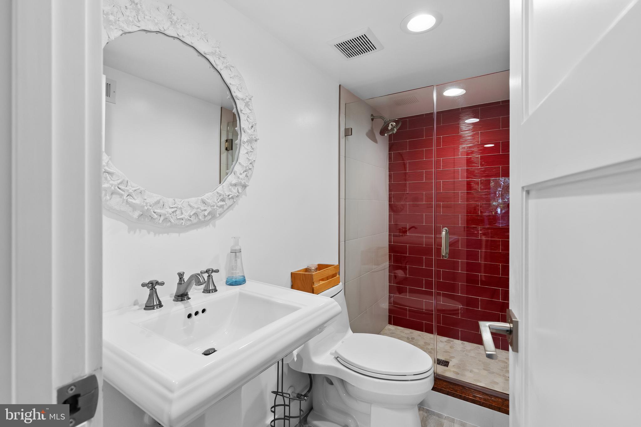 1428 Ravine Way Arnold, MD 21012 - Photo 23 of 43 a bathroom with a sink a toilet and shower