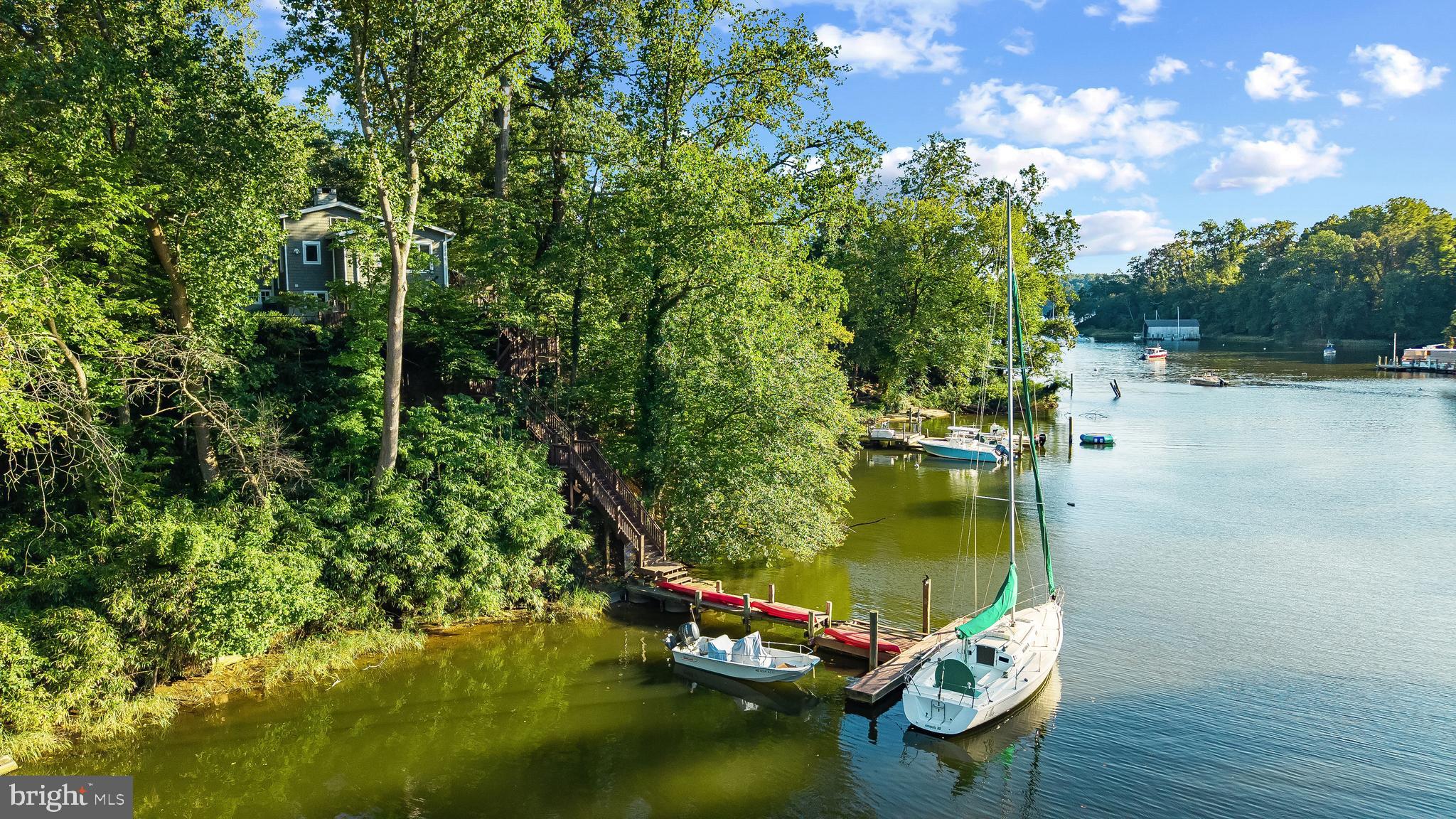 1428 Ravine Way Arnold, MD 21012 - Photo 27 of 43 swimming pool with trees in front of it