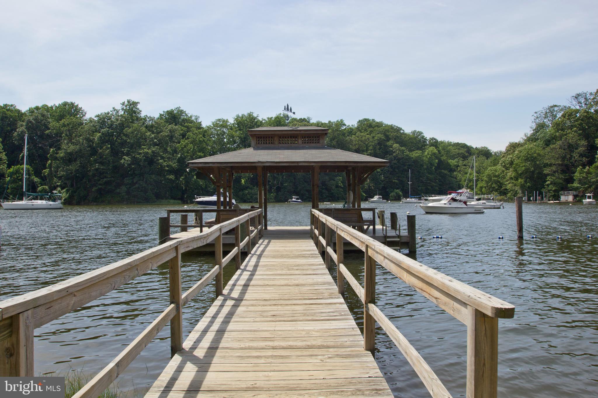 1428 Ravine Way Arnold, MD 21012 - Photo 38 of 43 a view of a house with large wooden deck