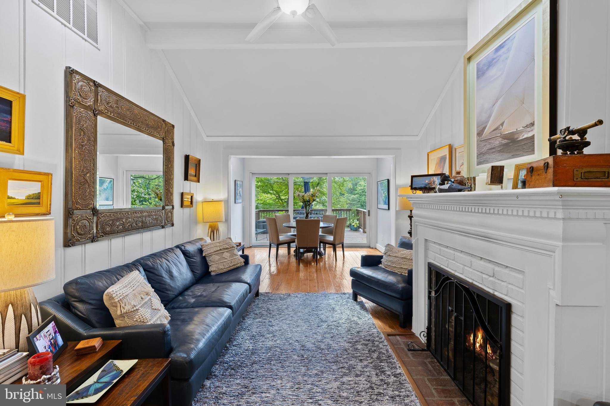 1428 Ravine Way Arnold, MD 21012 - Photo 8 of 43 a living room with furniture a fireplace and a large window