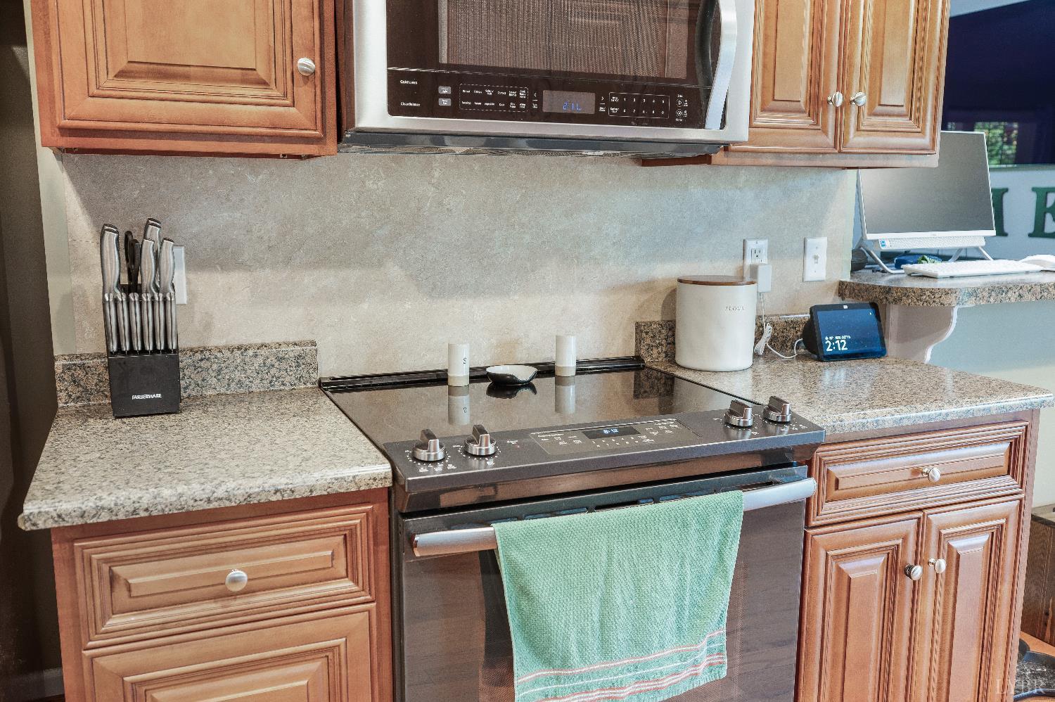 405 Marston Street Spout Spring, VA 24593 - Photo 11 of 58 a kitchen with kitchen island a sink a stove and cabinets