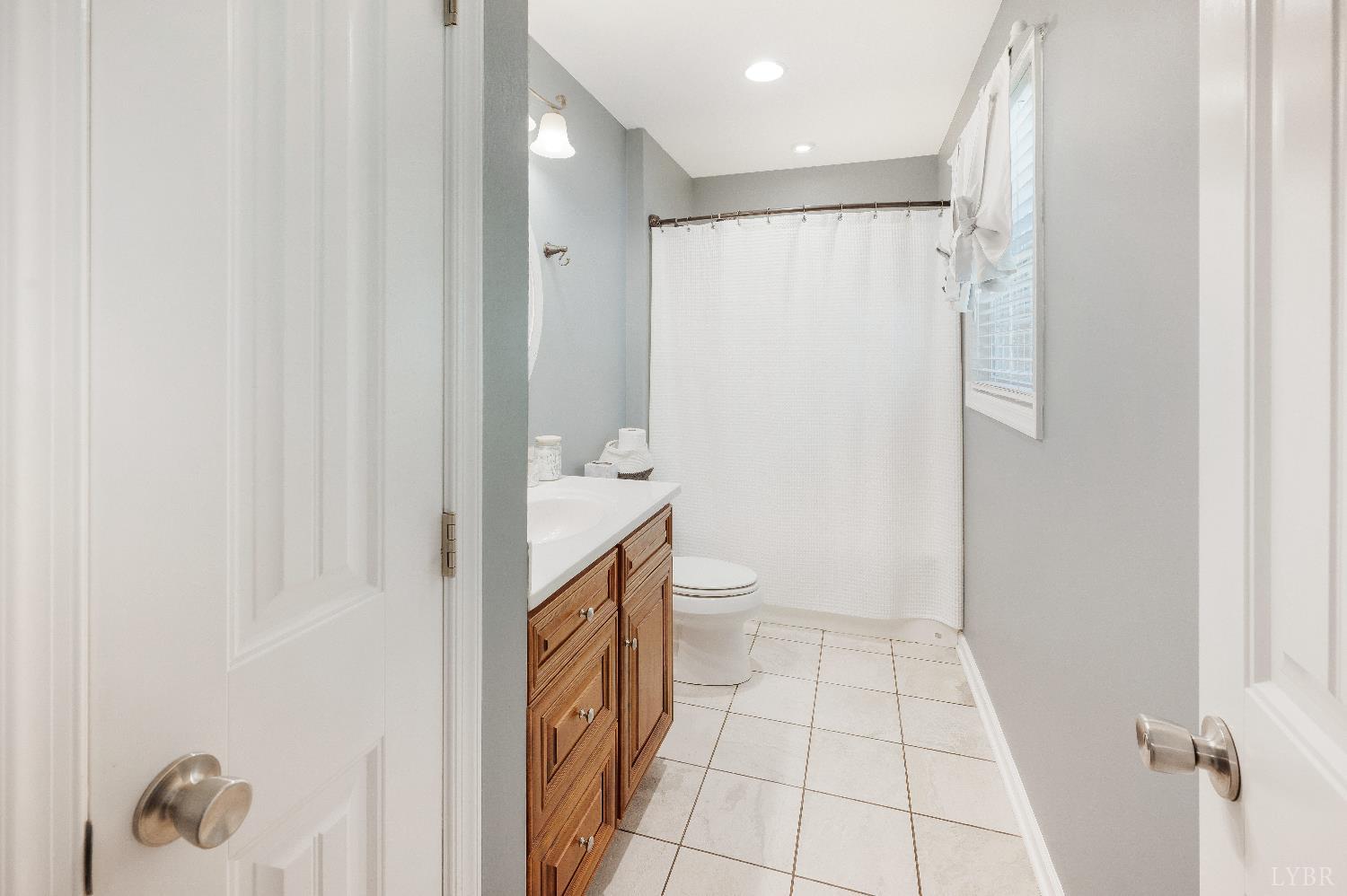405 Marston Street Spout Spring, VA 24593 - Photo 16 of 58 a bathroom with a shower and a toilet