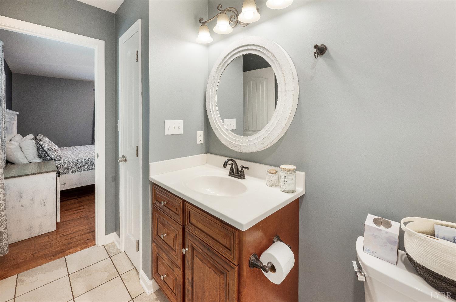 405 Marston Street Spout Spring, VA 24593 - Photo 17 of 58 a bathroom with a sink and a mirror