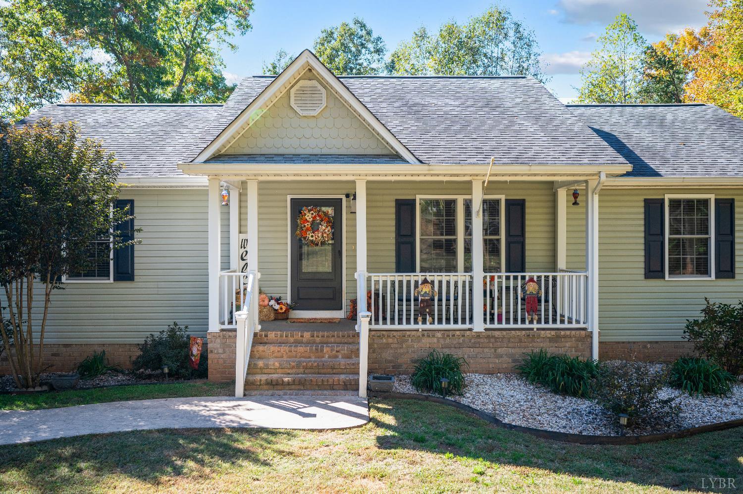 405 Marston Street Spout Spring, VA 24593 - Photo 2 of 58 a front view of a house with a garden