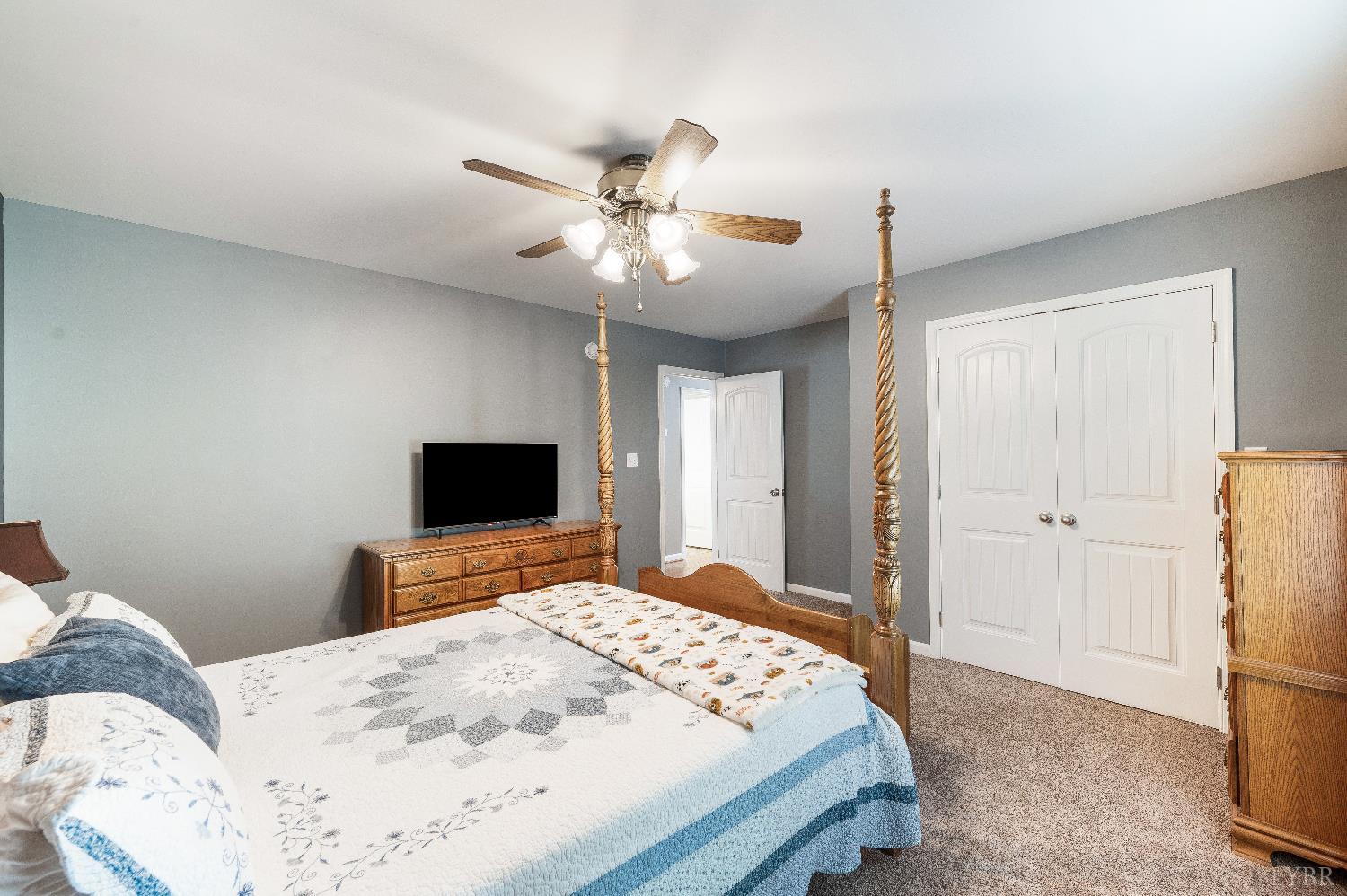 405 Marston Street Spout Spring, VA 24593 - Photo 21 of 58 a bedroom with a bed and a flat screen tv